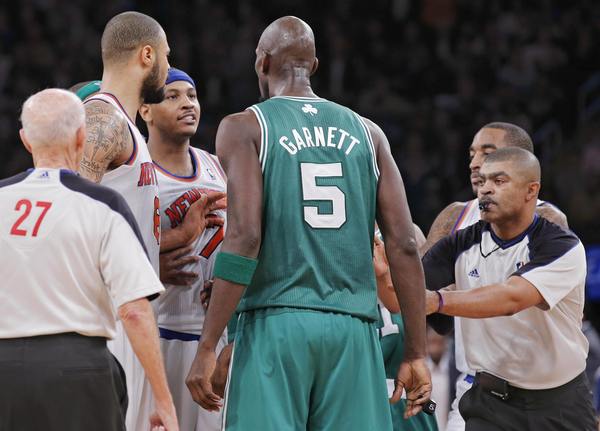 Referee Brothers moves to break up New York Knicks' Anthony and Boston Celtics' Garnett as they argue during their NBA basketball game in New York
